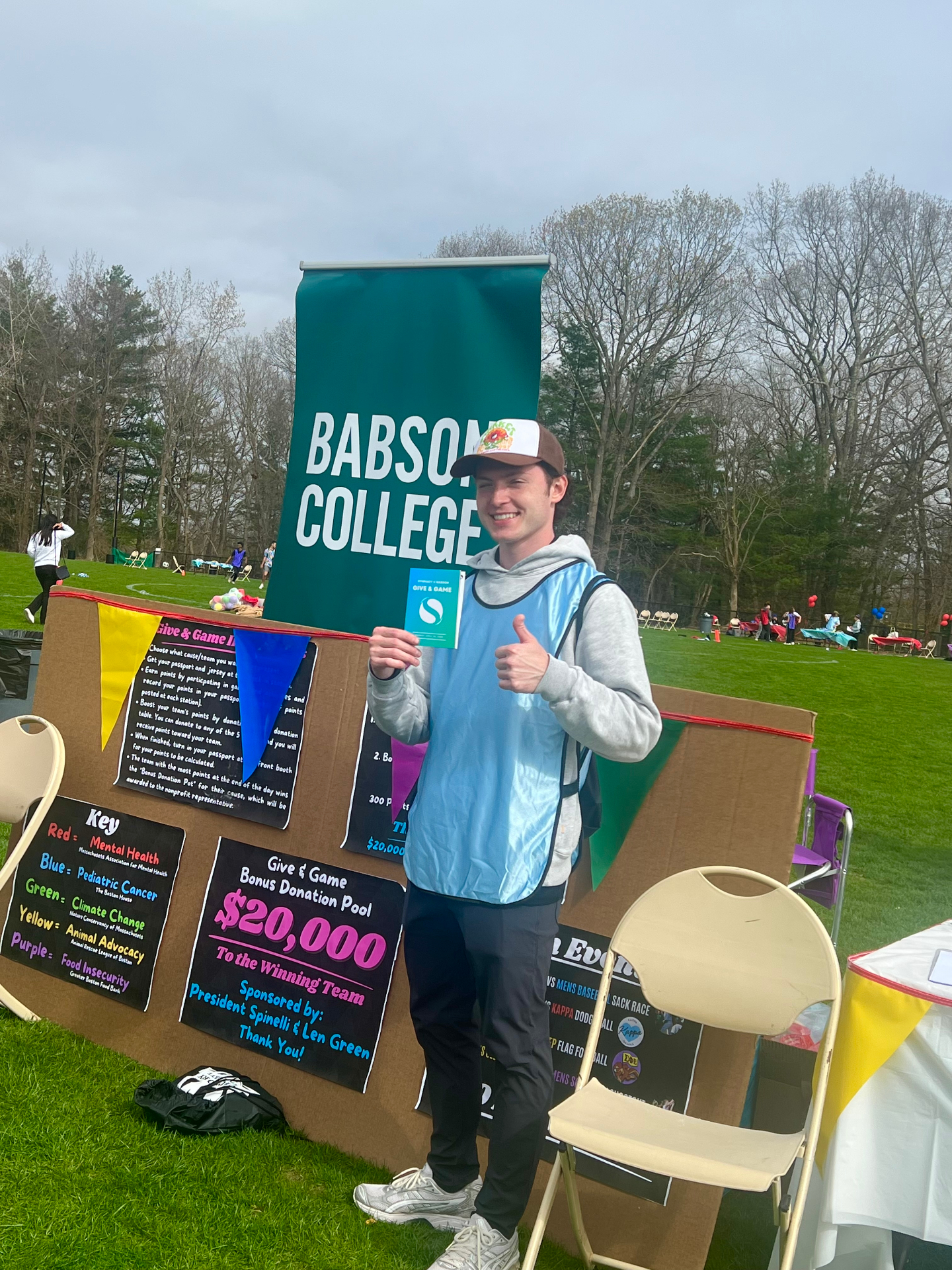 Dylan McNamara at the Give & Game $20,000 bonus donation pool sign